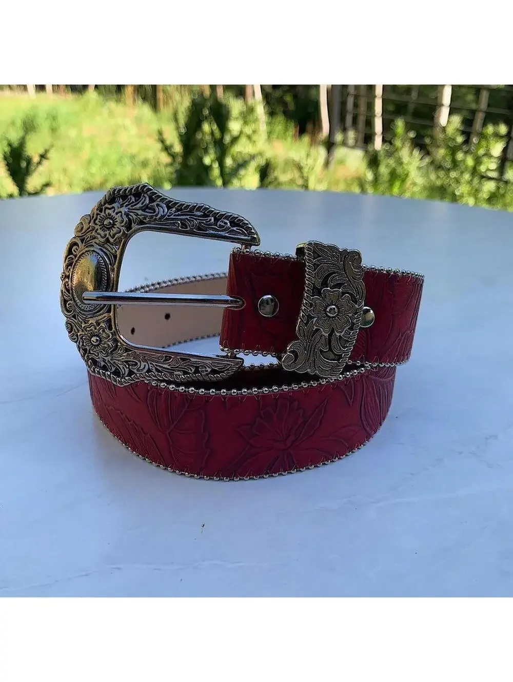Red Western Floral belt with silver belt buckle. 38 inches length